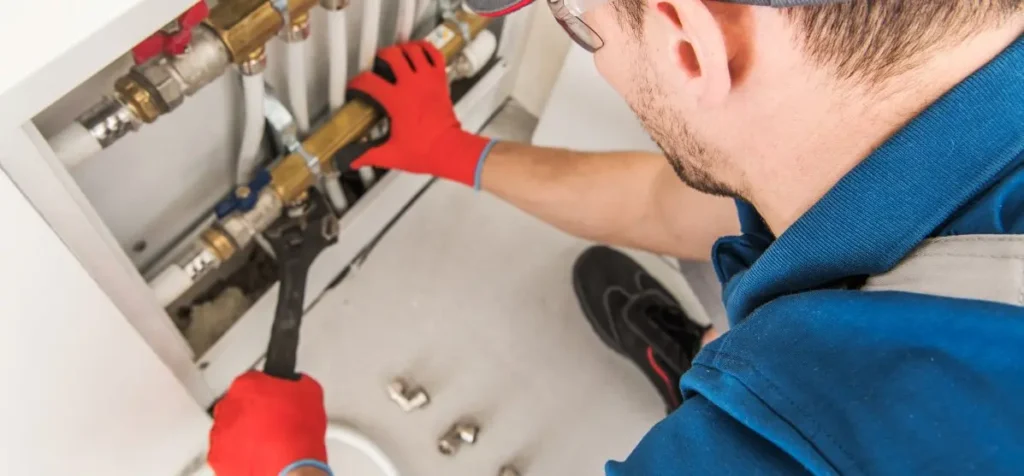 Certified plumber installing a plumbing fixture with precision and proper tools