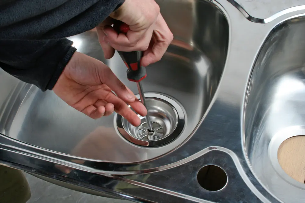Licensed plumber performing maintenance in a residential or commercial property in Gravenhurst, ON
