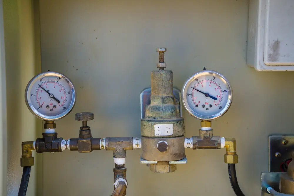 Poly-B Plumbing technician providing pressure testing as part of a maintenance membership visit
