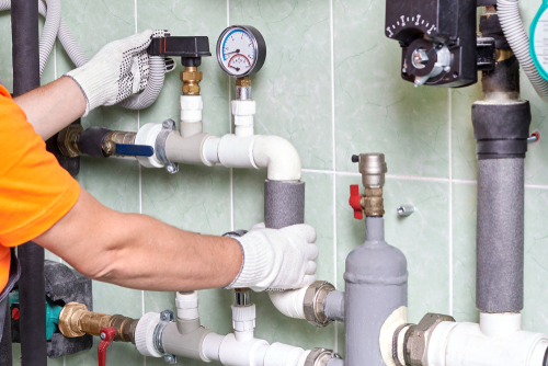 Licensed plumber providing plumbing services at a commercial property in Angus, ON