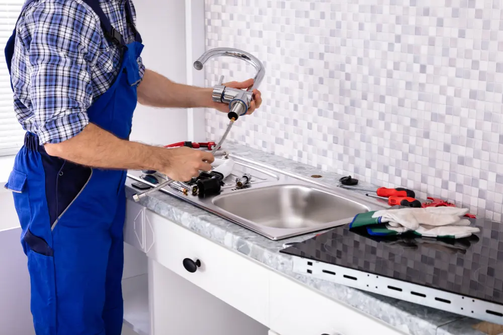 Plumber performing pipe installation at a residential property in Bracebridge, ON