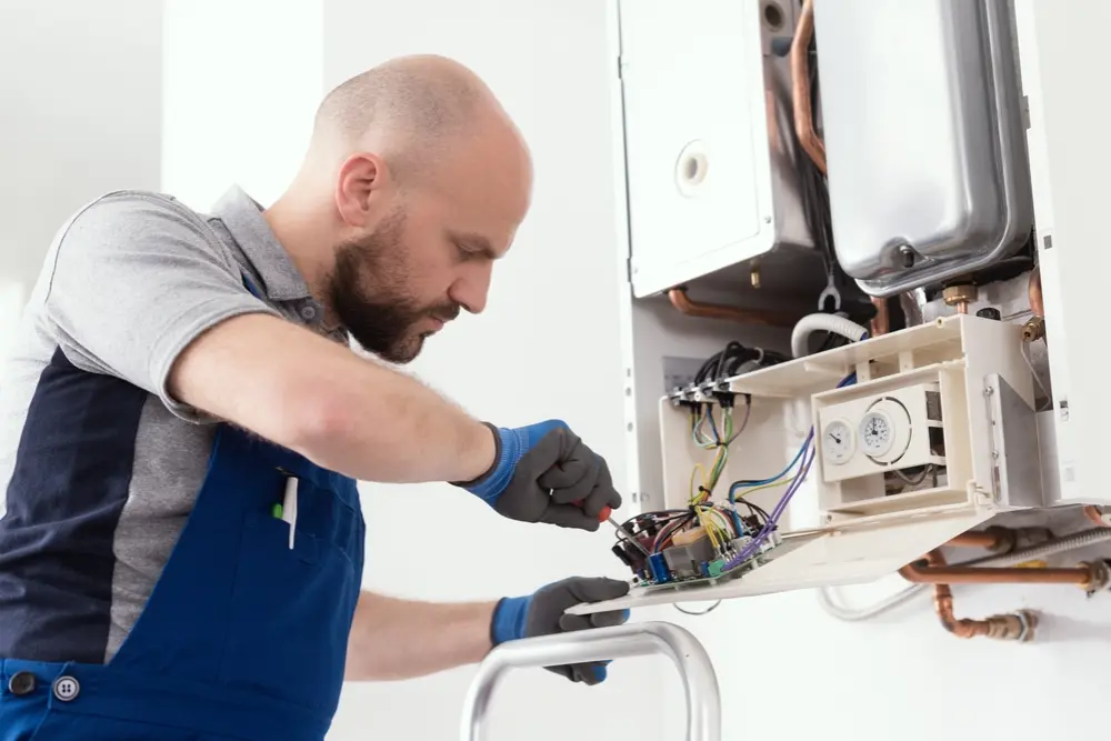 Plumber providing residential plumbing services in a home in Mattawa, ON