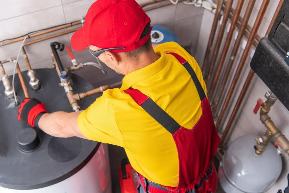 Licensed plumber performing plumbing repairs at a home in Washago, ON