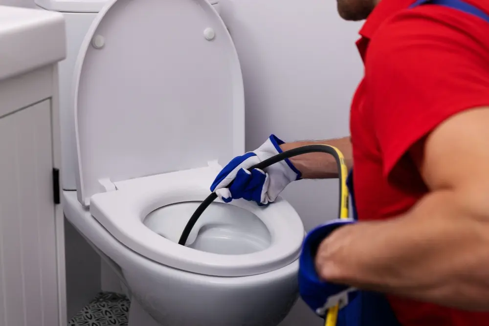 Leaking faucet, running toilet, and clogged sink in a residential Ontario bathroom
