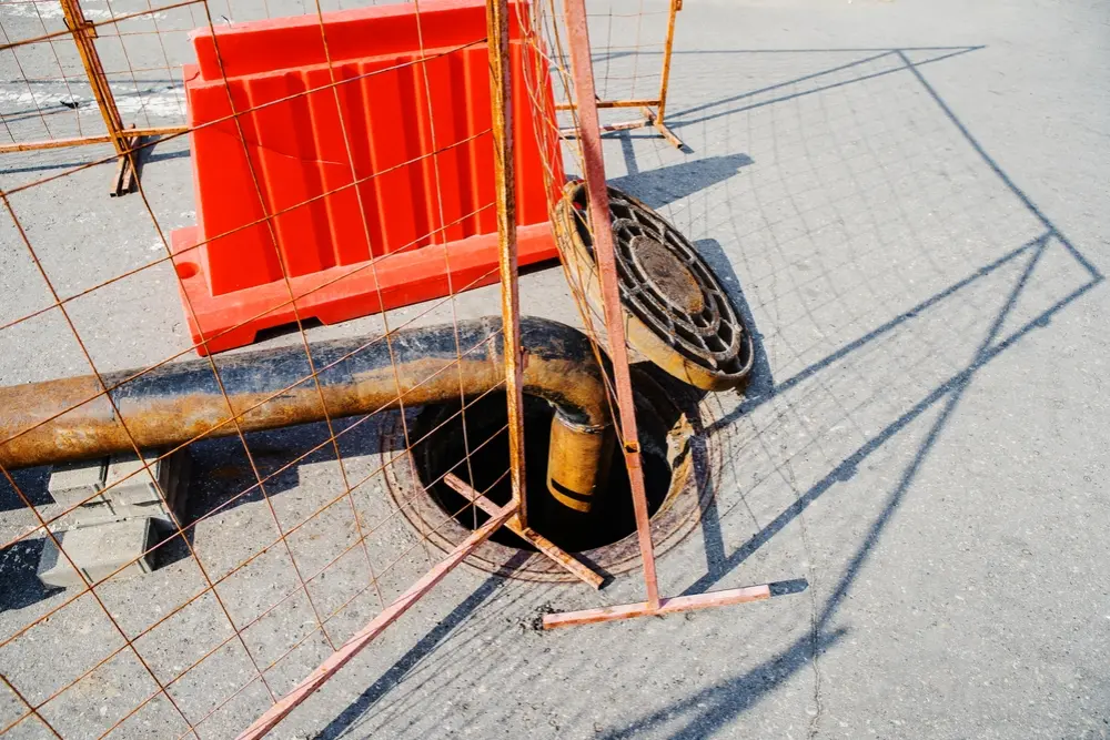 Illustration showing the property line dividing homeowner and municipal responsibility for underground plumbing