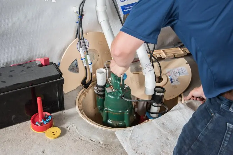 Plumber showing credentials and discussing job details with a homeowner before starting work